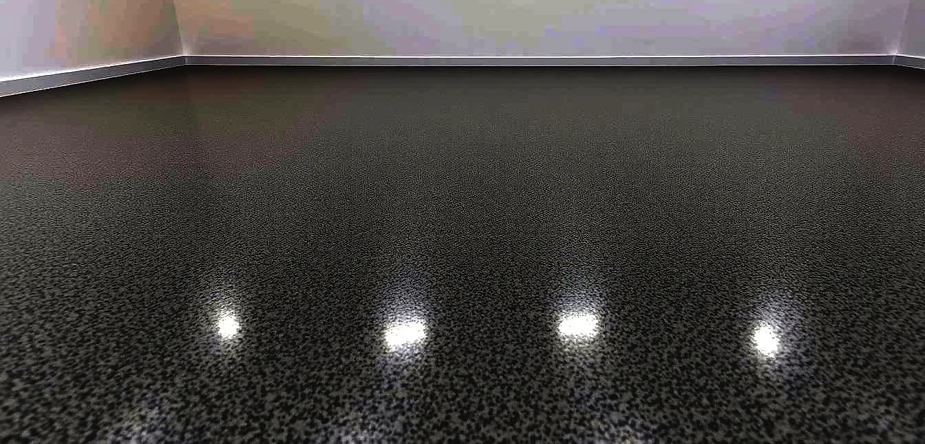 A high-quality commercial epoxy floor, characterized by a glossy, seamless finish, contrasts sharply with a more textured, matte-like residential epoxy