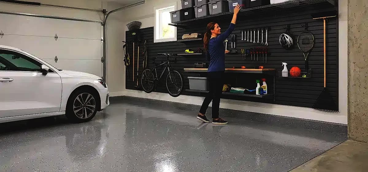 Properly elevated garage storage system keeping items off a pristine epoxy floor