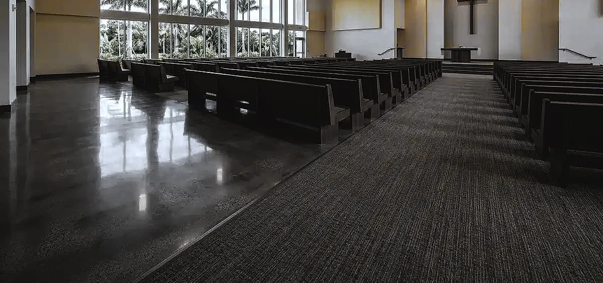 Comparison of polished concrete flooring versus traditional carpet in a modern South Florida church sanctuary