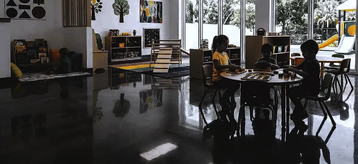 Brightly lit Pompano Beach daycare center featuring highly reflective polished concrete floors and colorful play areas