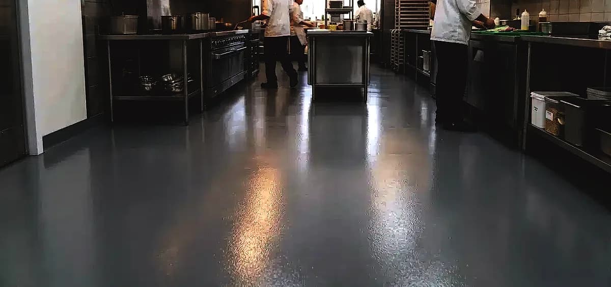 Seamless food-safe epoxy flooring installed in a commercial kitchen in Miami