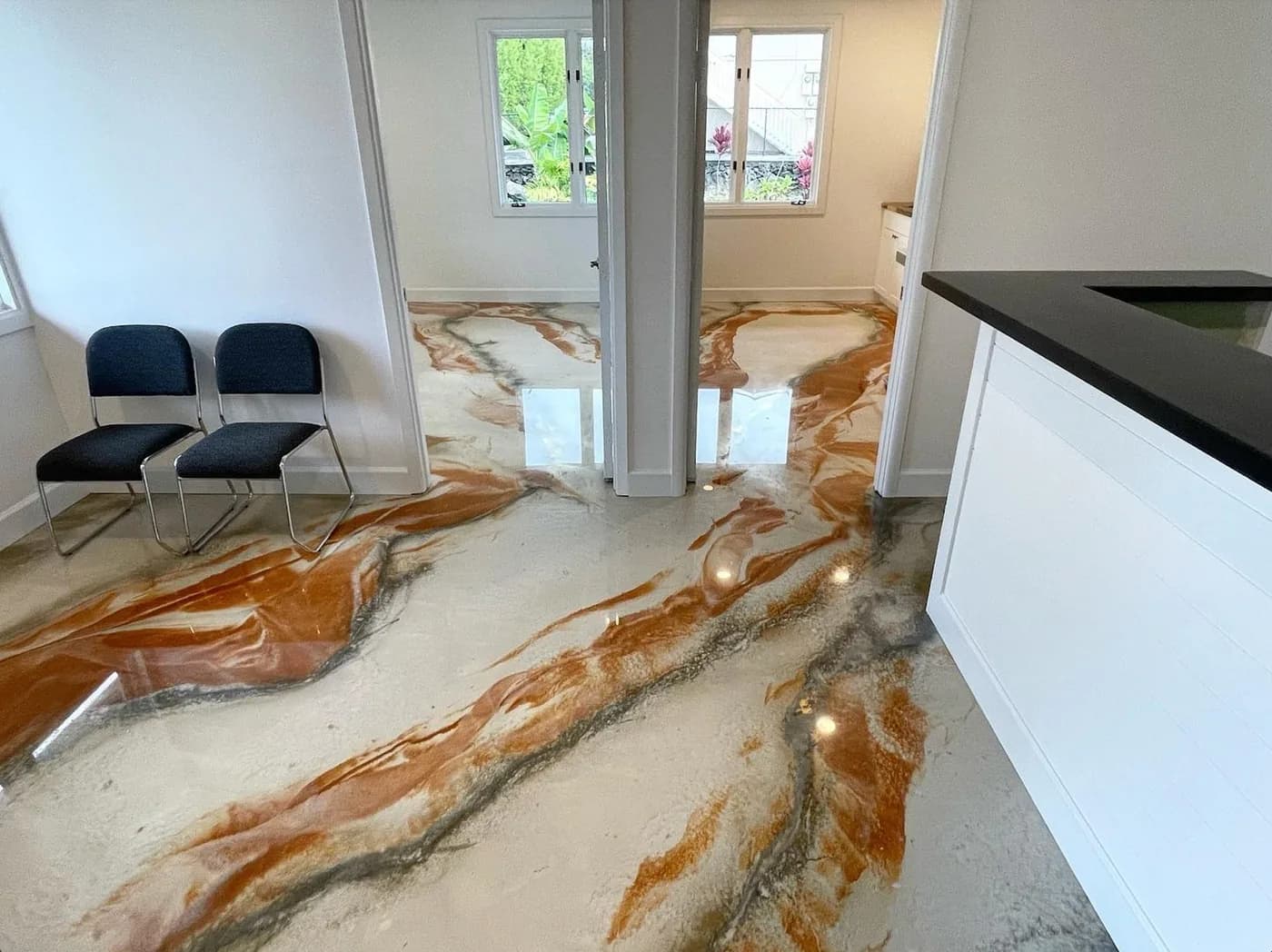 White and copper marble metallic epoxy floor in a reception area