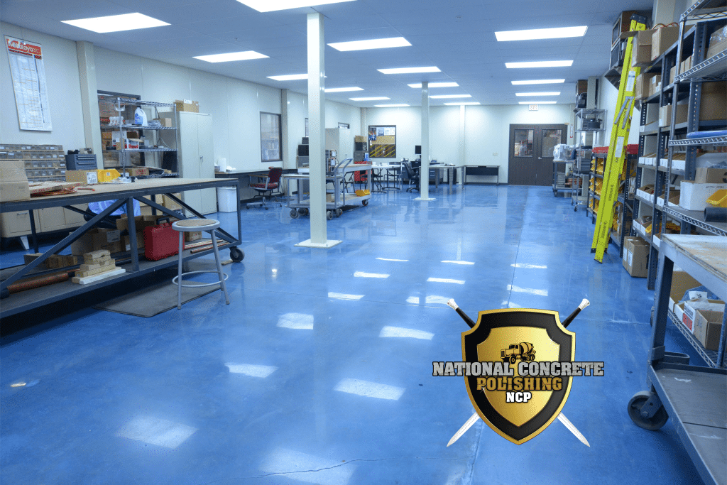 A polished concrete floor installed in a commercial workshop space.
